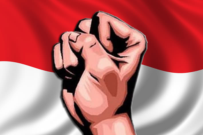 Ilustrasi tangan dan bendera Indonesia